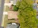 Aerial view showcasing the home's layout, mature trees, and private backyard at 210 Brittany Chase, Fayetteville, GA 30214