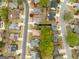 Aerial view of the property at 210 Brittany Chase surrounded by mature trees and lush landscaping at 210 Brittany Chase, Fayetteville, GA 30214