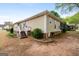 The backyard features a wood deck, mature landscaping, and vinyl siding at 210 Brittany Chase, Fayetteville, GA 30214