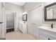 Bathroom with double sink, marble countertops, and ceramic tile flooring at 210 Brittany Chase, Fayetteville, GA 30214