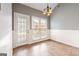 Bright breakfast nook features beadboard wainscoting, a back door, and a view to the backyard at 210 Brittany Chase, Fayetteville, GA 30214