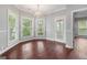 Dining area featuring hardwood floors, natural light, and a chandelier at 210 Brittany Chase, Fayetteville, GA 30214