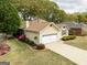 Inviting single-Gathering home with an attached garage, lush landscaping, and well-kept lawn at 210 Brittany Chase, Fayetteville, GA 30214