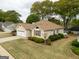 Well-maintained one-story home featuring an attached garage, verdant lawn, and established landscaping at 210 Brittany Chase, Fayetteville, GA 30214