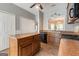 Traditional kitchen with wood cabinets, island, black appliances, and window to dining area at 210 Brittany Chase, Fayetteville, GA 30214