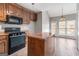 Kitchen featuring wood cabinets and tile flooring at 210 Brittany Chase, Fayetteville, GA 30214