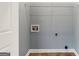 A laundry room with utility connections and a wire shelf at 210 Brittany Chase, Fayetteville, GA 30214