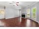 Open-concept living area featuring a fireplace, hardwood floors, and plenty of natural light at 210 Brittany Chase, Fayetteville, GA 30214