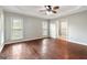 Spacious main bedroom with wood floors, tray ceiling, and ensuite bathroom access at 210 Brittany Chase, Fayetteville, GA 30214