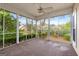 The screened in porch has neutral carpet and provides lovely views of the backyard at 210 Brittany Chase, Fayetteville, GA 30214