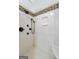 Shower with dual shower heads, a marble bench, and decorative tile detail at 210 Brittany Chase, Fayetteville, GA 30214