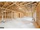 Unfinished basement awaiting customization and personalization with studded walls at 7260 Eton Ln, Locust Grove, GA 30248