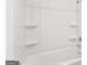 Bathroom with a white tub and shower combination with built-in shelves at 7260 Eton Ln, Locust Grove, GA 30248