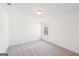 Bedroom featuring neutral carpet, one window, and ample natural light at 7260 Eton Ln, Locust Grove, GA 30248