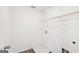 Walk-in closet with neutral flooring and rod, offering ample storage space at 7260 Eton Ln, Locust Grove, GA 30248