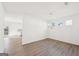 Open-concept dining area with hardwood floors adjacent to the kitchen space at 7260 Eton Ln, Locust Grove, GA 30248