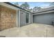 This backyard offers a patio space, entrance to the garage, and a privacy fence at 3387 Oak Dr, Lawrenceville, GA 30044