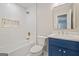 This updated bathroom offers a new vanity, gold fixtures, and a tub with new tile at 3387 Oak Dr, Lawrenceville, GA 30044