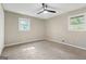 This bedroom features neutral walls, carpet, and two windows to allow for ample natural light at 3387 Oak Dr, Lawrenceville, GA 30044