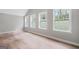 This bedroom features neutral walls, laminate floors, and three large windows at 3387 Oak Dr, Lawrenceville, GA 30044