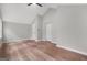 This bedroom features neutral walls, laminate floors, a ceiling fan, and two doors at 3387 Oak Dr, Lawrenceville, GA 30044