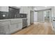 Modern kitchen featuring white cabinets, new stainless steel appliances, and Herringbone backsplash at 3387 Oak Dr, Lawrenceville, GA 30044