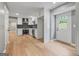 Newly renovated kitchen features stainless steel appliances, white cabinets, and a stylish backsplash at 3387 Oak Dr, Lawrenceville, GA 30044
