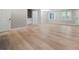 Spacious living room featuring new floors, modern lighting, and a refreshing, neutral color palette at 3387 Oak Dr, Lawrenceville, GA 30044
