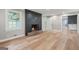 Inviting living room with a cozy fireplace, light wood floors, and lots of natural light at 3387 Oak Dr, Lawrenceville, GA 30044