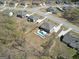 An aerial view showcasing a home with a private backyard oasis, pool, and is surrounded by mature trees at 270 Blue Point Pkwy, Fayetteville, GA 30215