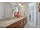Bright bathroom features double sinks, granite counters, and a large mirror at 270 Blue Point Pkwy, Fayetteville, GA 30215