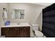 Functional bathroom with dark wood cabinets and a black shower curtain at 270 Blue Point Pkwy, Fayetteville, GA 30215