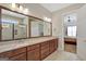Bathroom vanity featuring double sinks and granite countertops, with a view of the shower at 270 Blue Point Pkwy, Fayetteville, GA 30215