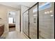 Bathroom with a frameless glass shower and a view to the bedroom at 270 Blue Point Pkwy, Fayetteville, GA 30215