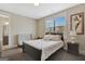Cozy bedroom with neutral colors, a window, and an ensuite bathroom at 270 Blue Point Pkwy, Fayetteville, GA 30215