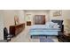 Comfortable bedroom features dark wood furniture and is brightly illuminated at 270 Blue Point Pkwy, Fayetteville, GA 30215