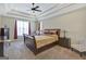 Spacious bedroom with a tray ceiling, soft carpet, and abundant natural light for a cozy atmosphere at 270 Blue Point Pkwy, Fayetteville, GA 30215