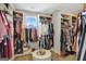 Well-organized walk-in closet with shelving, clothing racks, and a window for natural light at 270 Blue Point Pkwy, Fayetteville, GA 30215