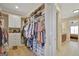 Organized walk-in closet featuring built-in shelving, drawers, and ample storage at 270 Blue Point Pkwy, Fayetteville, GA 30215