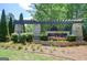The Canoe Club entrance sign with stone columns and pergola amidst lush landscaping at 270 Blue Point Pkwy, Fayetteville, GA 30215