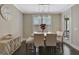 Elegant dining room featuring stylish decor, modern lighting, and beautiful hardwood floors at 270 Blue Point Pkwy, Fayetteville, GA 30215