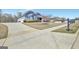 Long driveway leading to a charming home with a well-maintained lawn and mature trees at 270 Blue Point Pkwy, Fayetteville, GA 30215