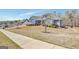Landscaped lawn and sidewalk lead to this charming home, showcasing its blue siding and architectural details at 270 Blue Point Pkwy, Fayetteville, GA 30215