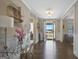 A foyer with hardwood floors, a decorative table, and a view of the front door at 270 Blue Point Pkwy, Fayetteville, GA 30215