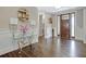 A foyer features hardwood floors, a decorative table, and an ornate front door at 270 Blue Point Pkwy, Fayetteville, GA 30215