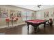 Stylish game room with a pool table, seating area, and comic book art creating an engaging entertainment space at 270 Blue Point Pkwy, Fayetteville, GA 30215