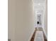 Long hallway with hardwood floors and recessed lighting at 270 Blue Point Pkwy, Fayetteville, GA 30215