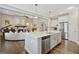 Gourmet kitchen with white cabinets, stainless steel appliances, and an open layout at 270 Blue Point Pkwy, Fayetteville, GA 30215