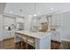 Modern kitchen with a large island, white cabinetry, and stainless steel appliances at 270 Blue Point Pkwy, Fayetteville, GA 30215