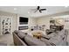 Open-concept living room with modern fireplace, built-in shelving, and seamless flow to the kitchen at 270 Blue Point Pkwy, Fayetteville, GA 30215